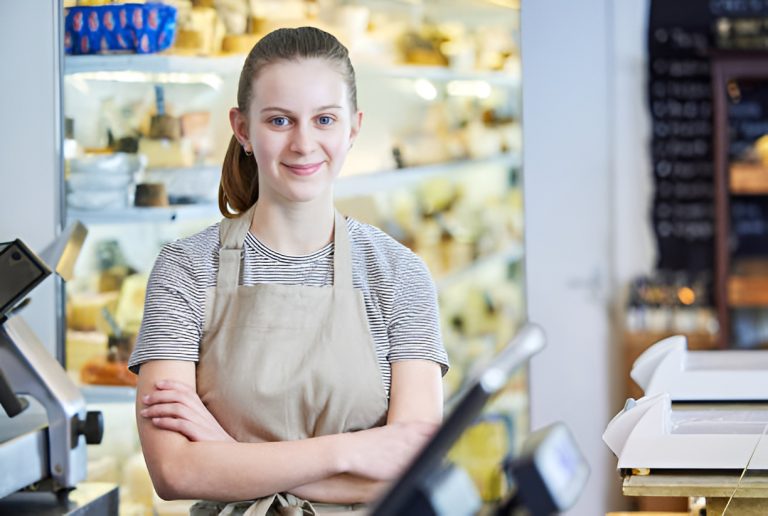 teen working as a cashier in a retail store